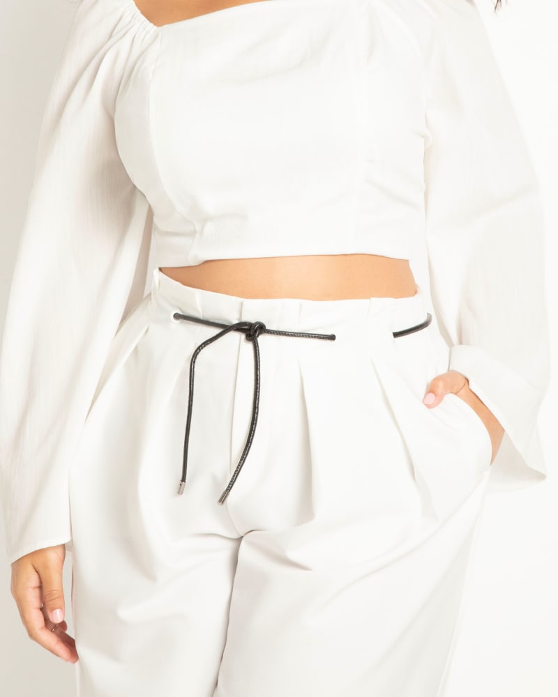 Side of a model wearing a size 28 Tie Back Cropped Linen Top in Snow White by ELOQUII. | dia_product_style_image_id:303814